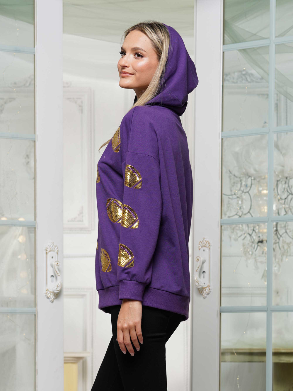 Half-zip hoodie with a relaxed fit and football sequin embroidery