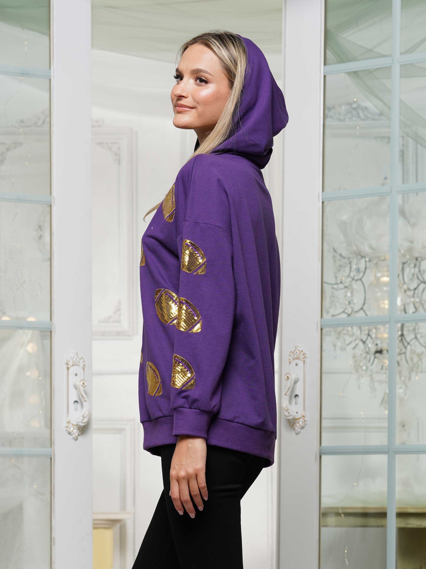 Half-zip hoodie with a relaxed fit and football sequin embroidery