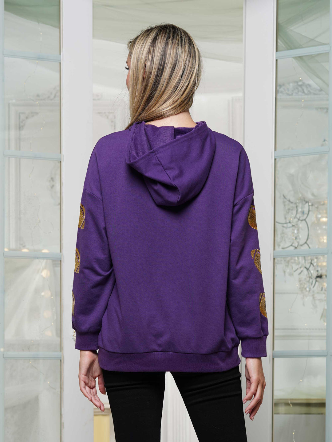 Half-zip hoodie with a relaxed fit and football sequin embroidery