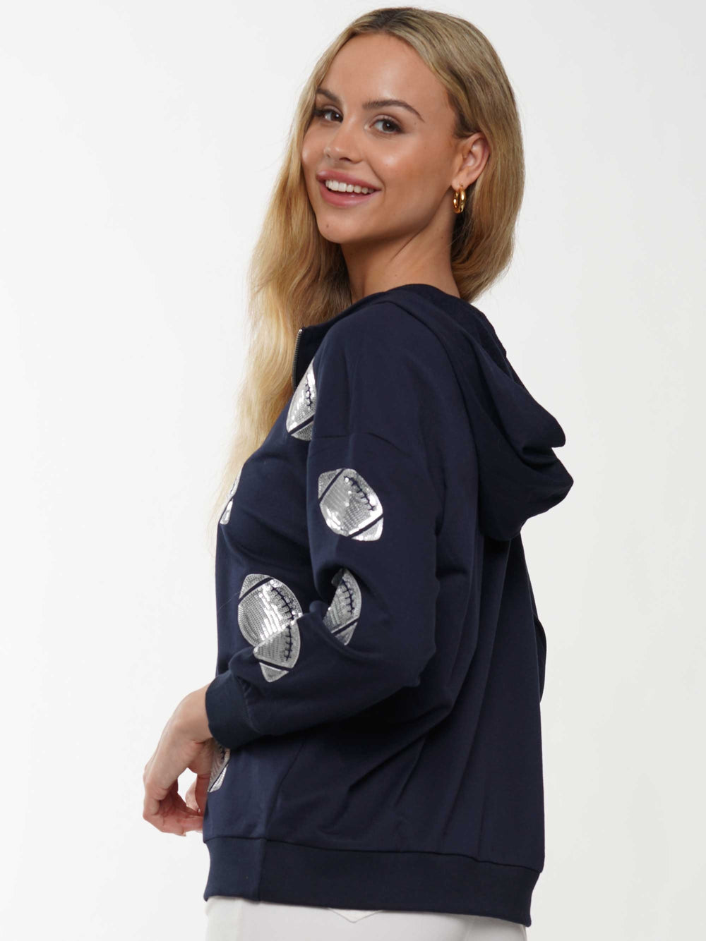 Half-zip hoodie with a relaxed fit and football sequin embroidery